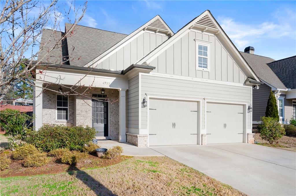 4733 Stridemore Court Mableton, GA 30126 - Photo 1 of 1 a view of a white house with large windows and plants