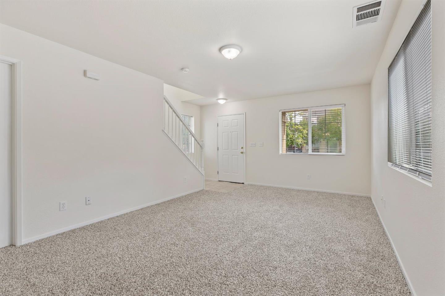 4347 Mathias Way Merced, CA 95348 - Photo 6 of 20 an empty room with windows