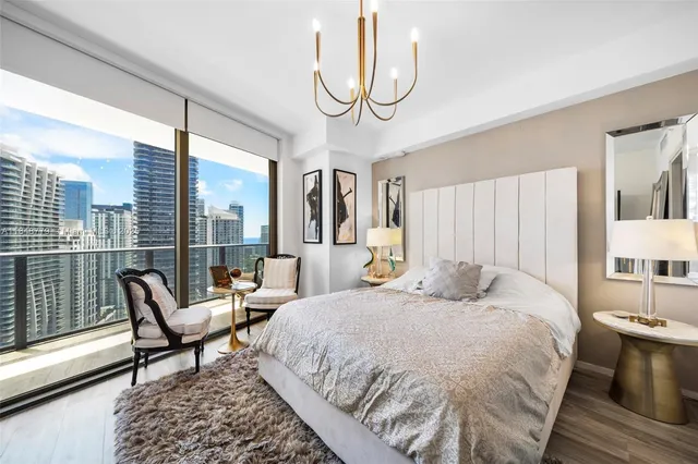 a bathroom with a double vanity sink and mirror with toilet