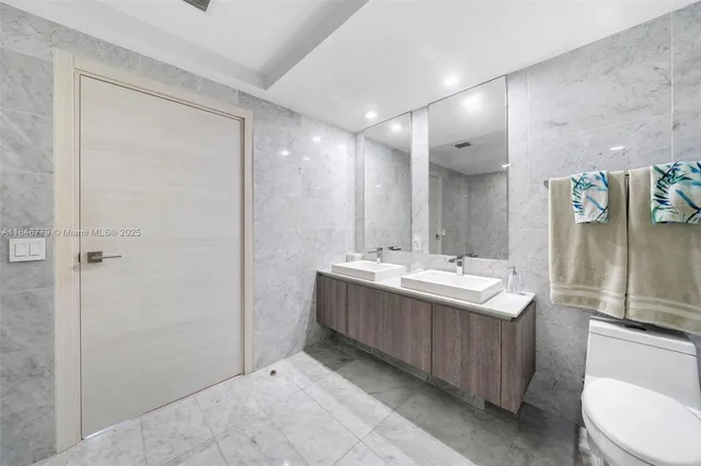 a view of a bathroom with sink and mirror