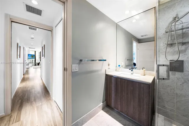 a room with a bed and a chandelier