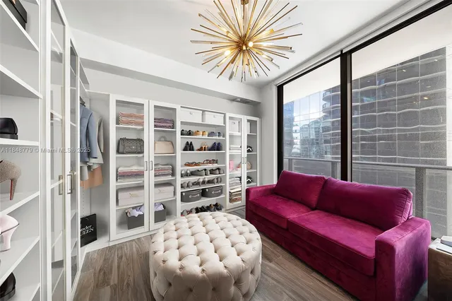 a bedroom with a bed and a mirror