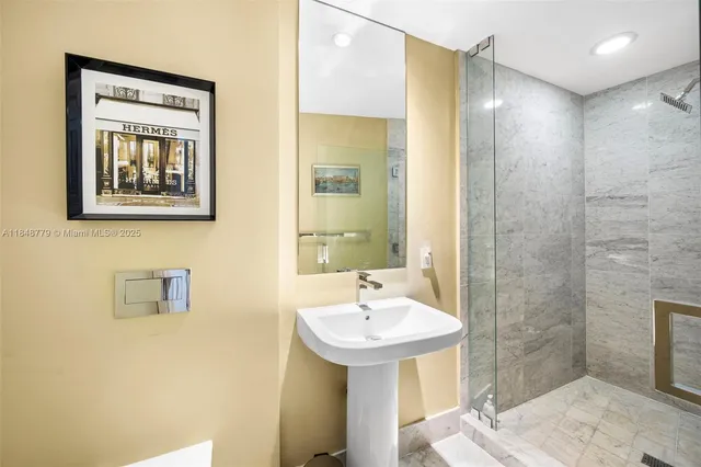 a outdoor space with lots of white furniture and a couch