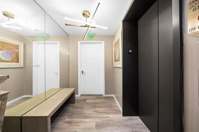a view of a roof deck with table and chairs and potted plants