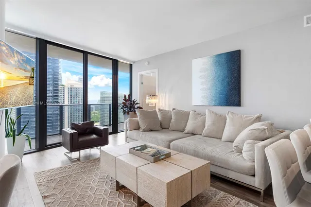 a kitchen with granite countertop a sink and stove top oven