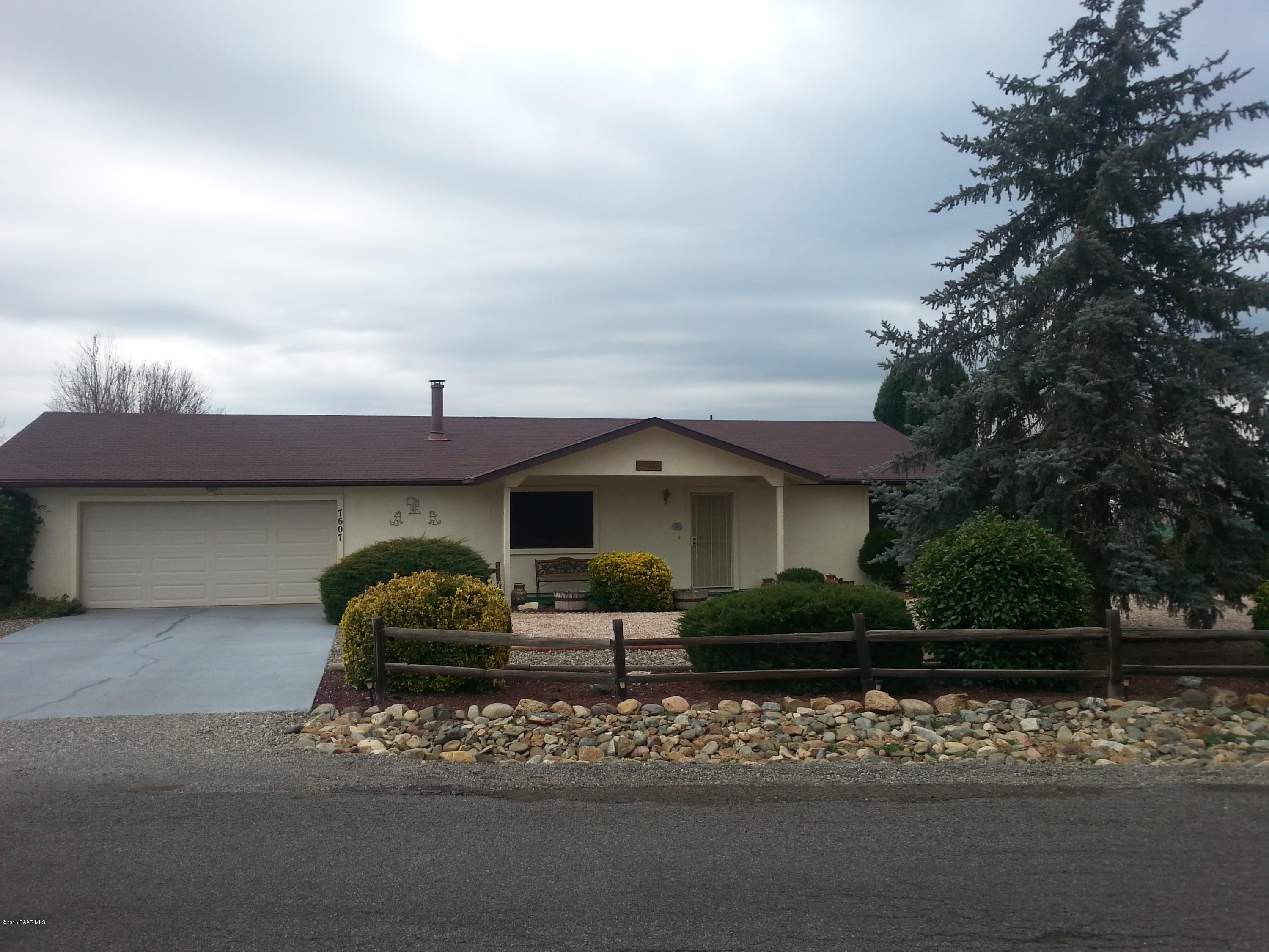 7607 East Cocopah Drive Prescott Valley, AZ 86314 - Photo 1 of 1 a front view of a house with garden