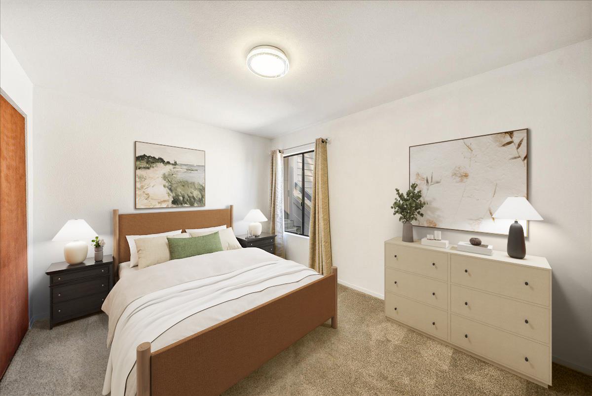 3095 Marina Drive, Unit 2 Marina, CA 93933 - Photo 14 of 25 a bedroom with a bed and a lamp on dresser