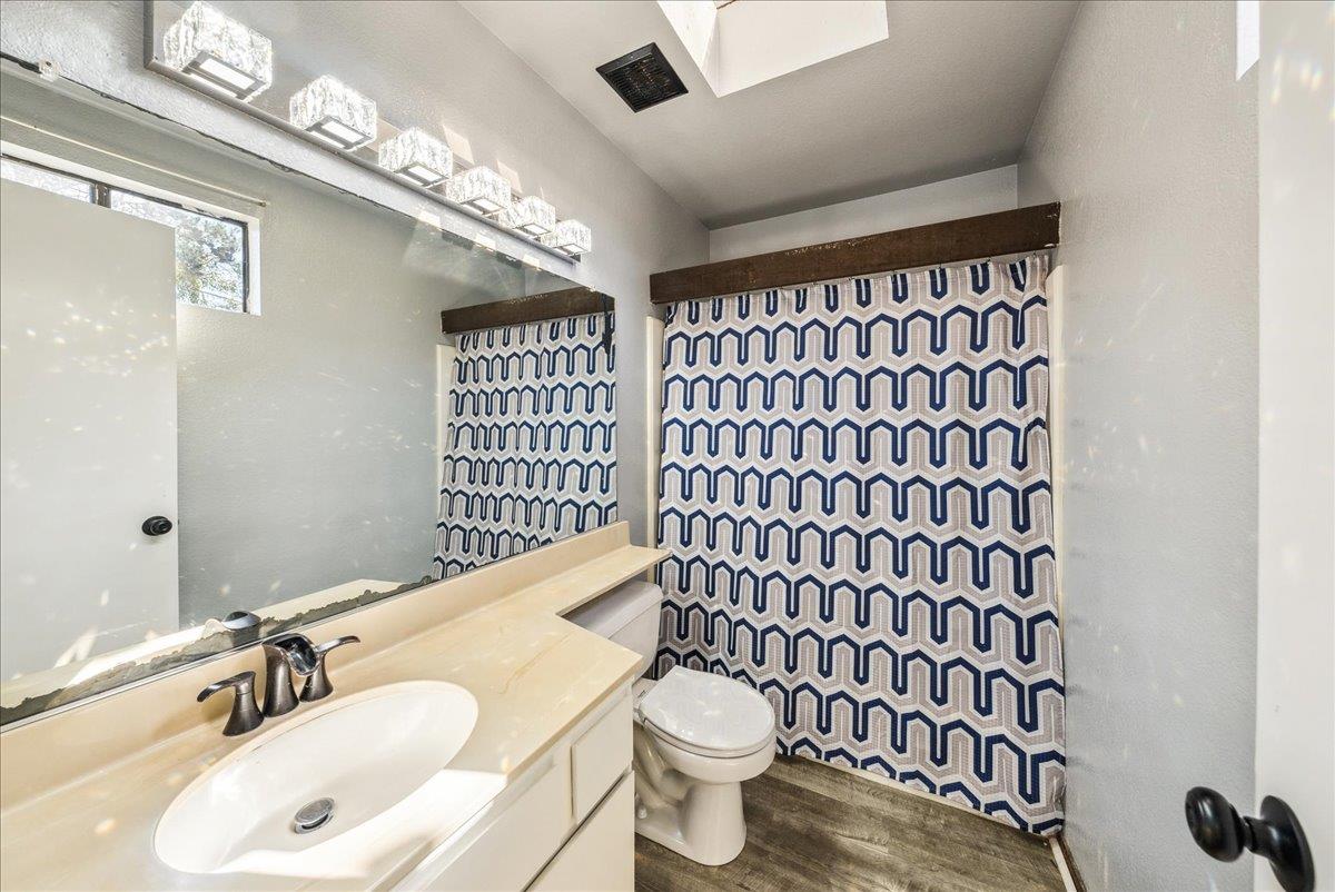 3095 Marina Drive, Unit 2 Marina, CA 93933 - Photo 16 of 25 a bathroom with a sink a toilet and shower curtain