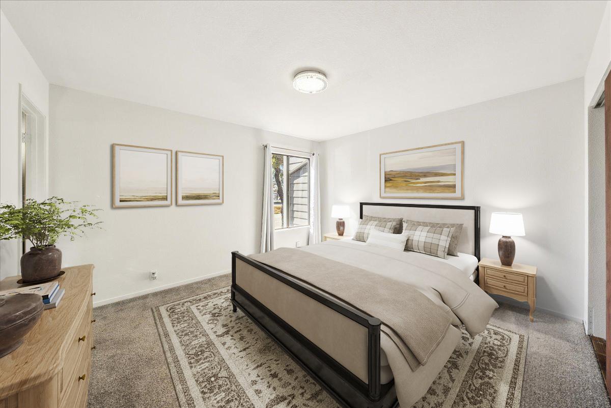 3095 Marina Drive, Unit 2 Marina, CA 93933 - Photo 17 of 25 a bedroom with a large bed and a potted plant