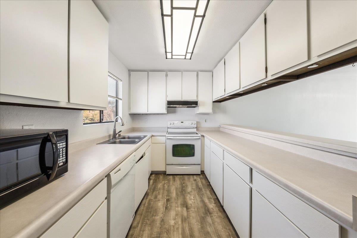 3095 Marina Drive, Unit 2 Marina, CA 93933 - Photo 10 of 25 a kitchen with a white cabinets and white appliances