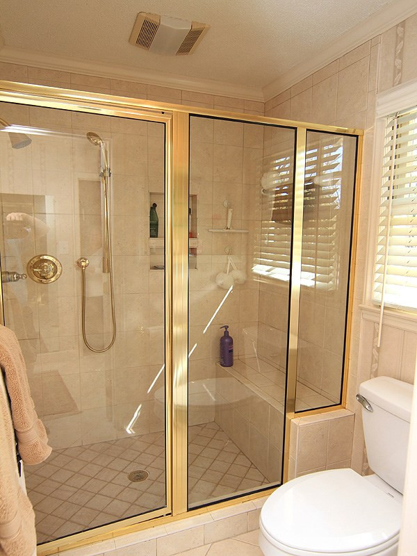 113 Dabney Road Cary, NC 27511 - Photo 12 of 19 Oversized ceiling to floor tiled, seated Shower is inviting for luxurious bathing. Separate Shower