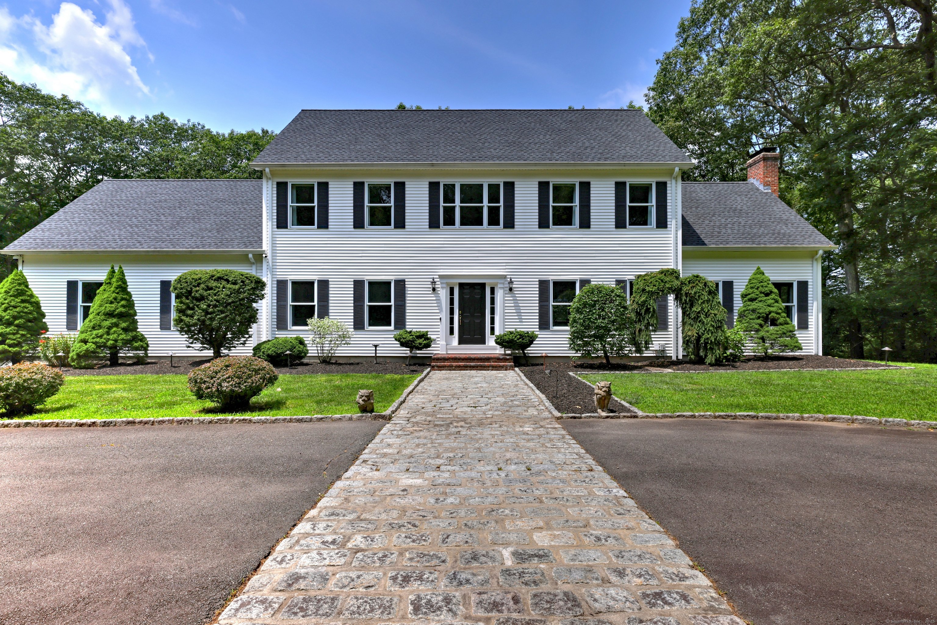 front view of a house with a yard