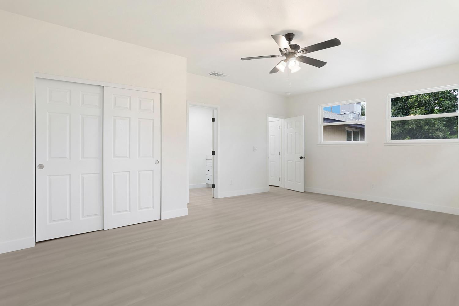 834 North Filbert Street Stockton, CA 95205 - Photo 12 of 22 a view of an empty room with a ceiling fan