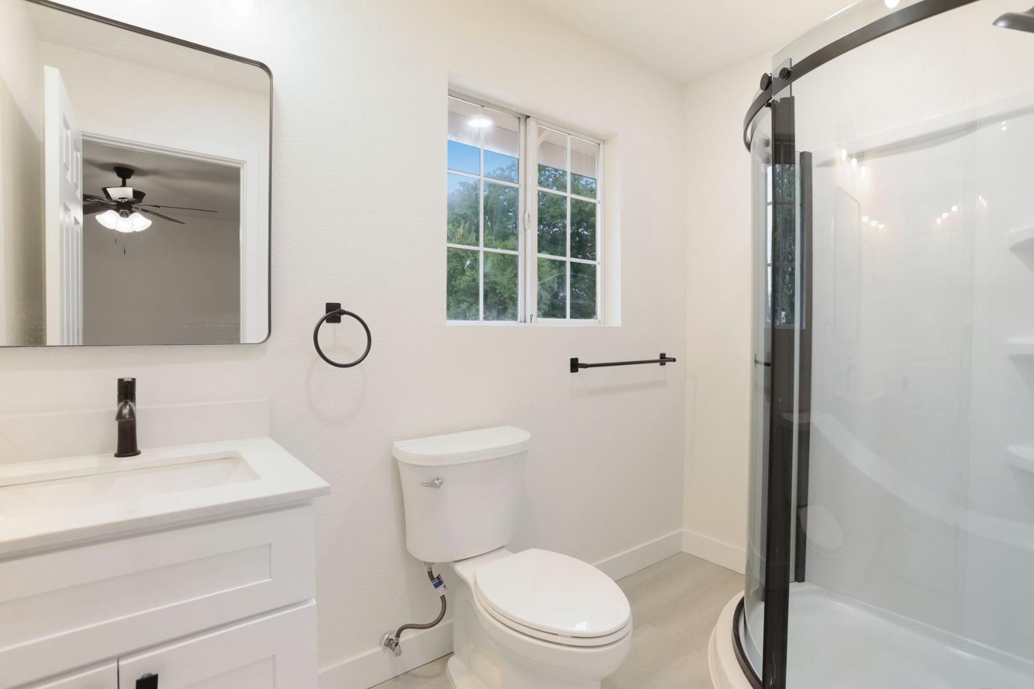 834 North Filbert Street Stockton, CA 95205 - Photo 16 of 22 a bathroom with a toilet sink and shower