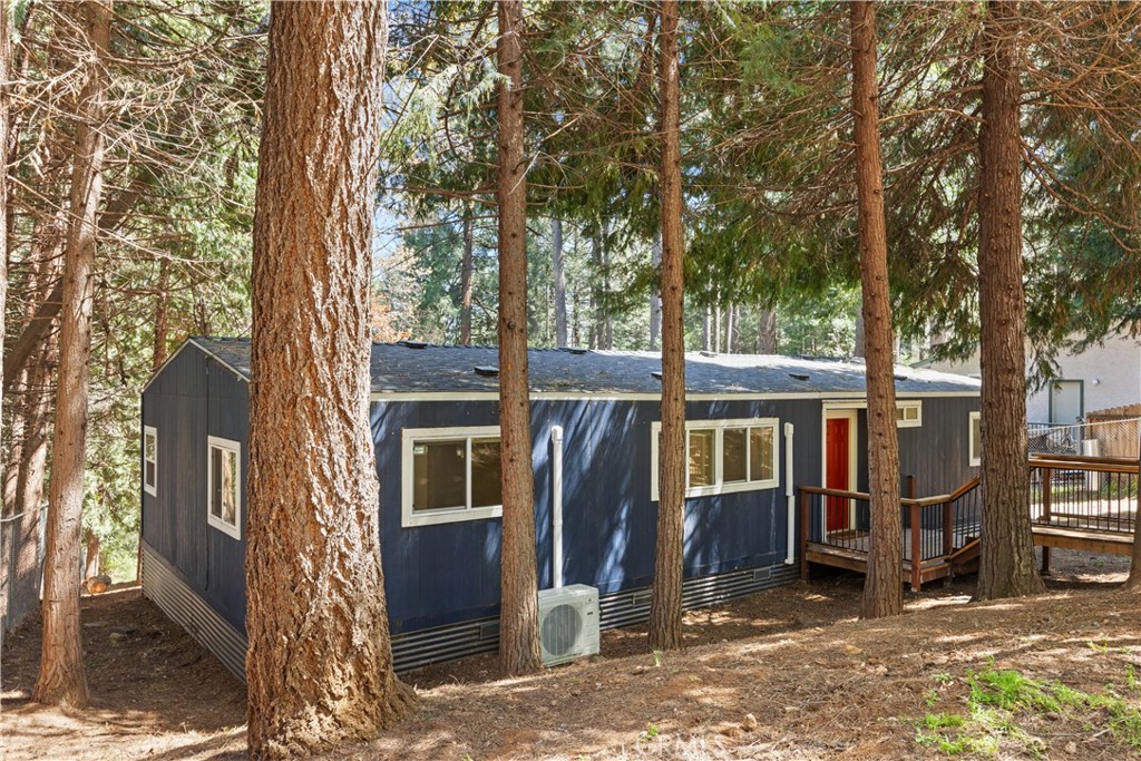 a view of a house with backyard porch and sitting area