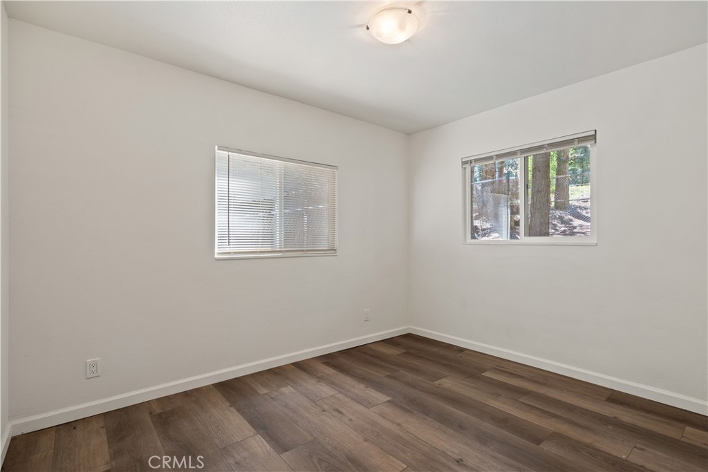 14742 Colter Way Magalia, CA 95954 - Photo 15 of 19 a view of empty room with wooden floor