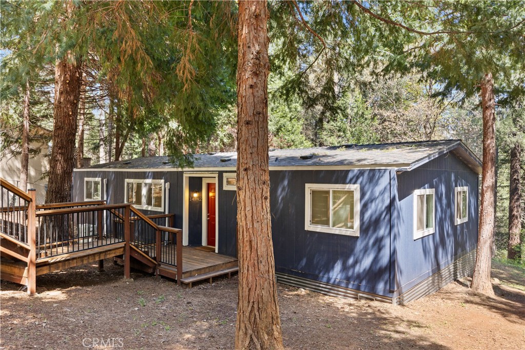 14742 Colter Way Magalia, CA 95954 - Photo 3 of 19 a view of a house with a large window and wooden fence