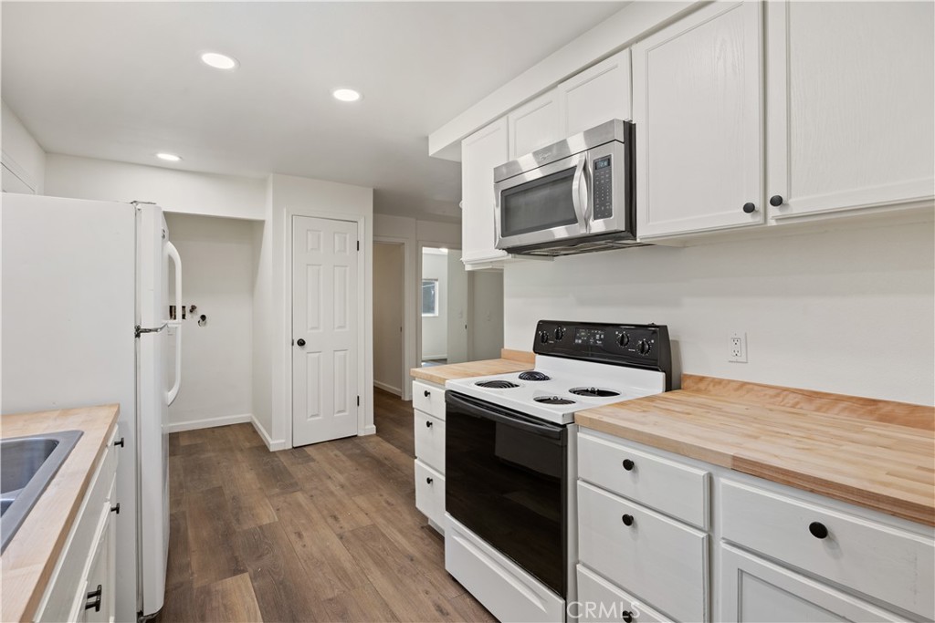 14742 Colter Way Magalia, CA 95954 - Photo 9 of 19 a kitchen with stainless steel appliances granite countertop a stove a sink and a refrigerator