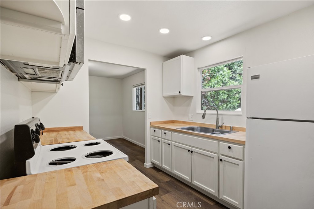 14742 Colter Way Magalia, CA 95954 - Photo 10 of 19 a kitchen that has a sink a stove and a refrigerator