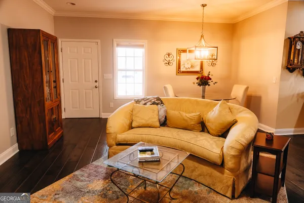 a living room with a couch and a dresser
