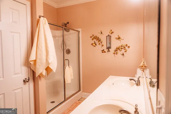 a bathroom with a bathtub and shower