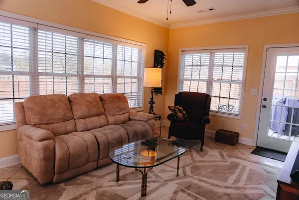 a living room with furniture and a window