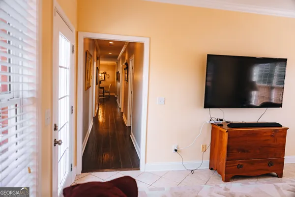 a view of living room with furniture and a flat screen tv
