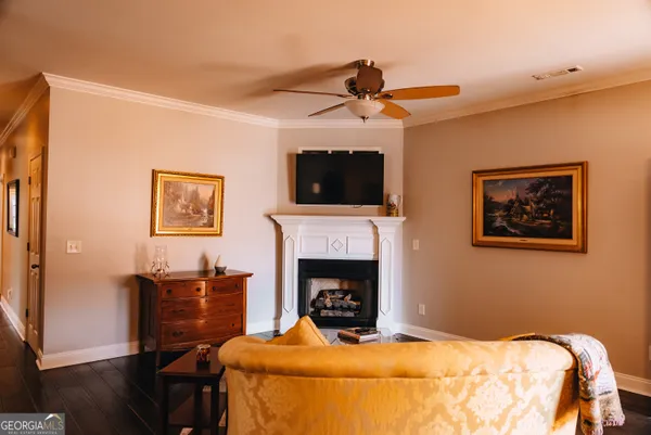 a bedroom with furniture and a fireplace