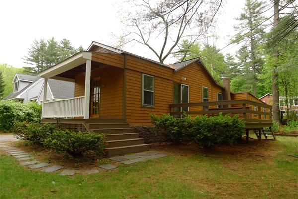 10 Spruce Road Groton, MA 01450 - Photo 1 of 17 a front view of a house with garden