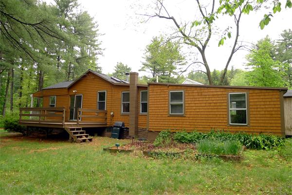 10 Spruce Road Groton, MA 01450 - Photo 3 of 17 a view of a house with a yard