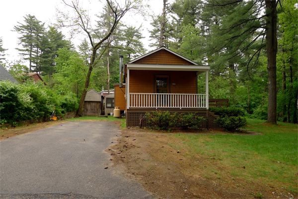 10 Spruce Road Groton, MA 01450 - Photo 4 of 17 a front view of a house with garden