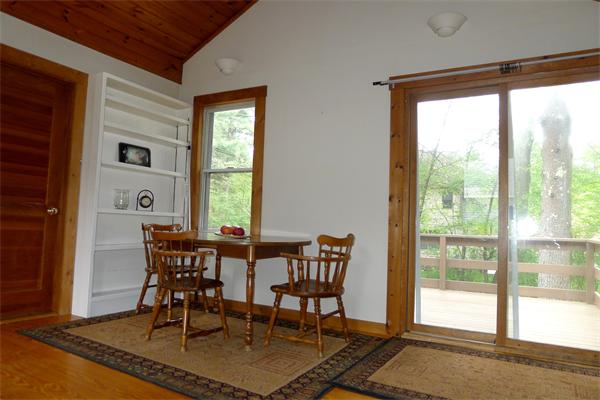 10 Spruce Road Groton, MA 01450 - Photo 8 of 17 a view of a dining room with furniture window and wooden floor