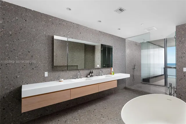 a bathroom with a double vanity sink mirror and double