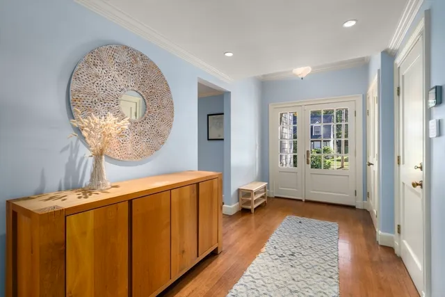 a view of a hallway with a window and a mirror