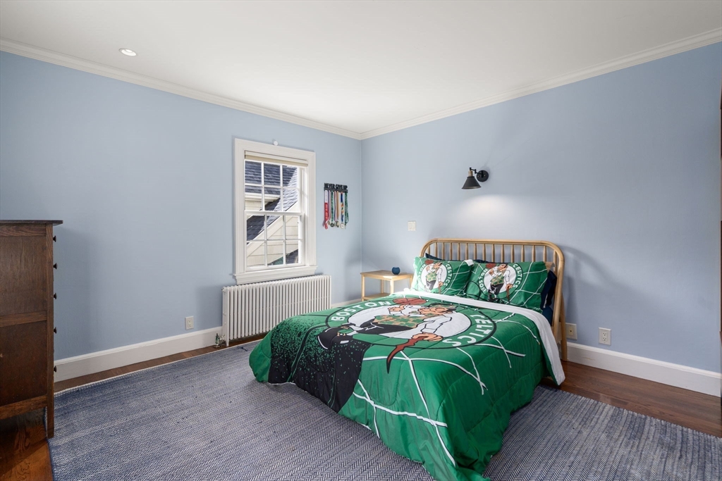 131 Oliver Road Newton, MA 02468 - Photo 18 of 33 a bedroom with a bed and a window