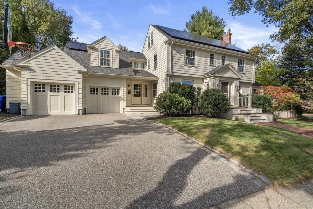 131 Oliver Road Newton, MA 02468 - Photo 2 of 33 a front view of a house with a yard