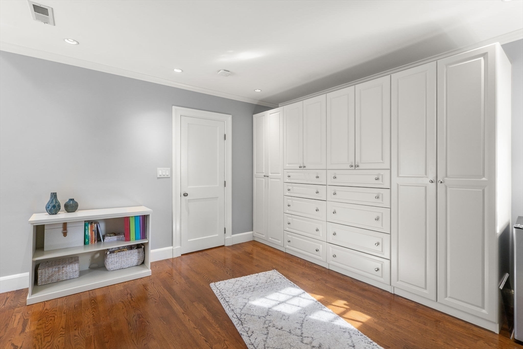 131 Oliver Road Newton, MA 02468 - Photo 23 of 33 a view of a bedroom with cabinet and mirror