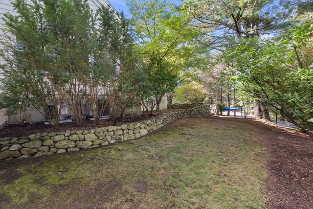 a view of a tree in front of a house