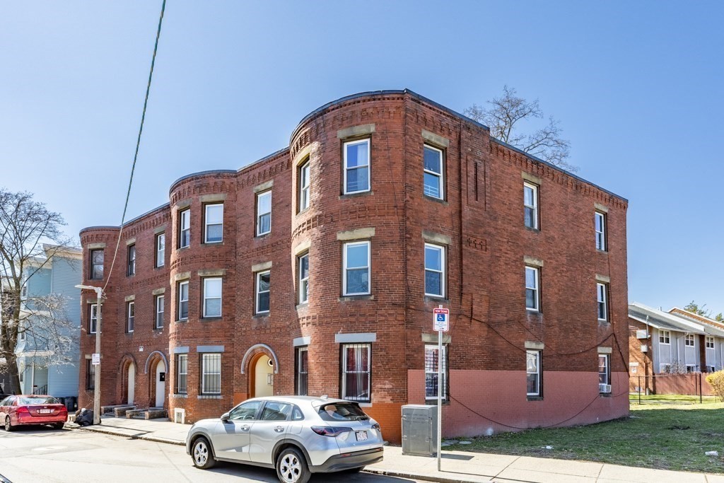 113 Regent Street Boston, MA 02119 - Photo 18 of 18 a front view of a residential apartment building with a yard