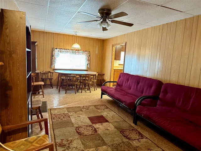 a bedroom with a bed dresser and a window