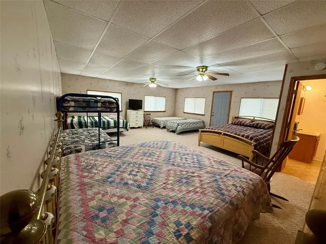 a bedroom with bed and window