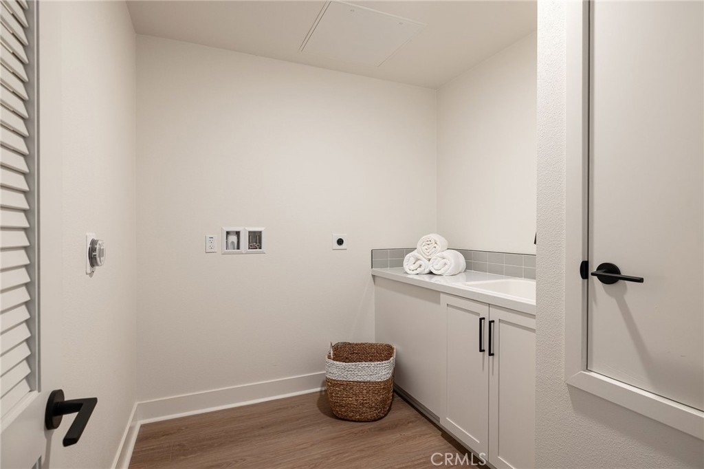 414 Main Street, Unit 330 Huntington Beach, CA 92648 - Photo 13 of 42 a bathroom with a toilet and a shower