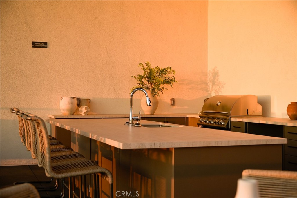 414 Main Street, Unit 330 Huntington Beach, CA 92648 - Photo 25 of 42 a bathroom with a sink and a mirror