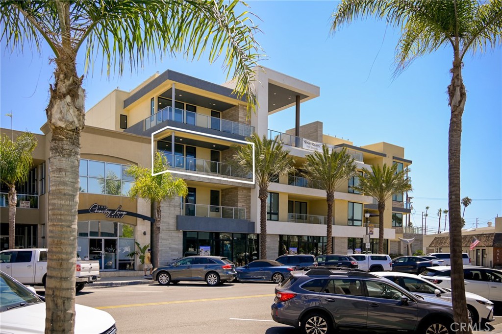414 Main Street, Unit 330 Huntington Beach, CA 92648 - Photo 3 of 42 a car parked in front of a building