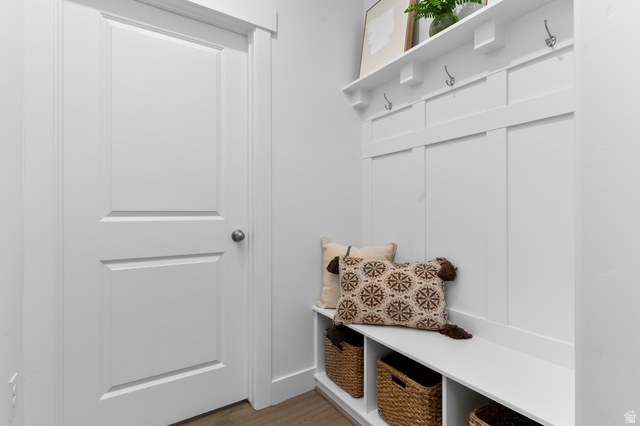 2819 South 710th West, Unit 14 Logan, UT 84321 - Photo 8 of 24 Entryway featuring white paneled door, built-in bench seating, upper shelving, and coat hooks