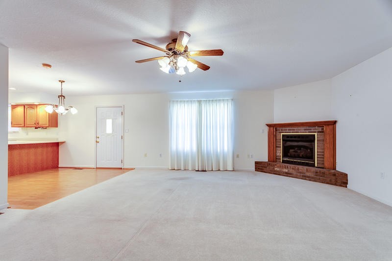 1549 Ailor Gap Road Luttrell, TN 37779 - Photo 8 of 29 an empty room with windows and fireplace