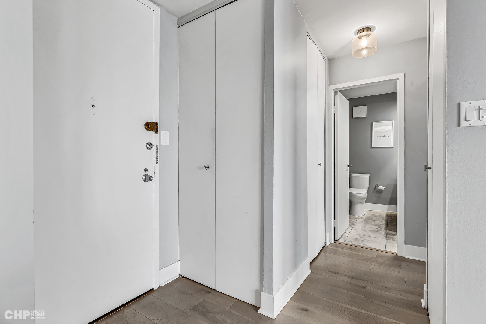 111 East Chestnut Street, Unit 49H Chicago, IL 60611 - Photo 17 of 27 a view of a bathroom from a hallway