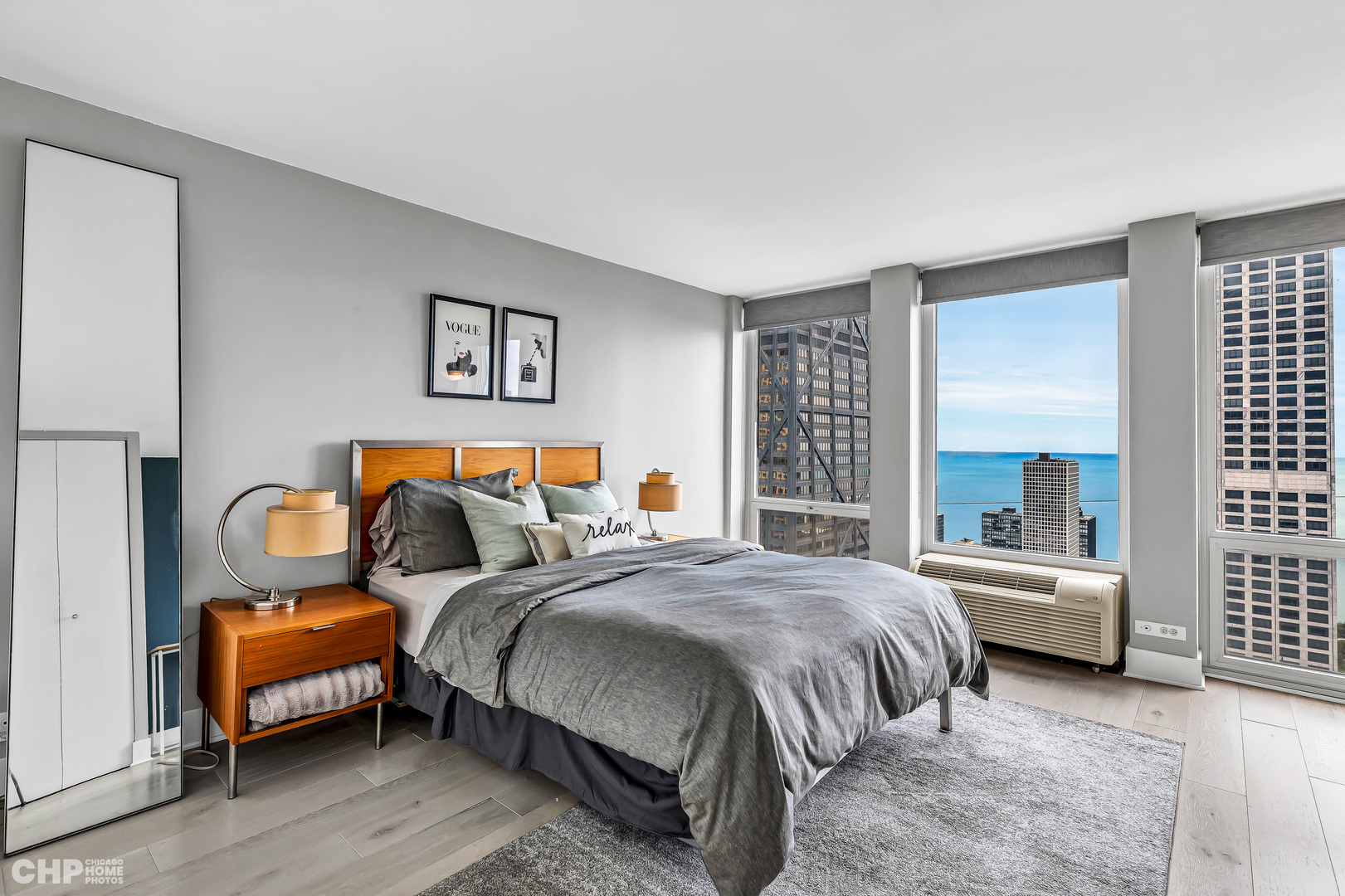 111 East Chestnut Street, Unit 49H Chicago, IL 60611 - Photo 18 of 27 a bedroom with two beds and a couch