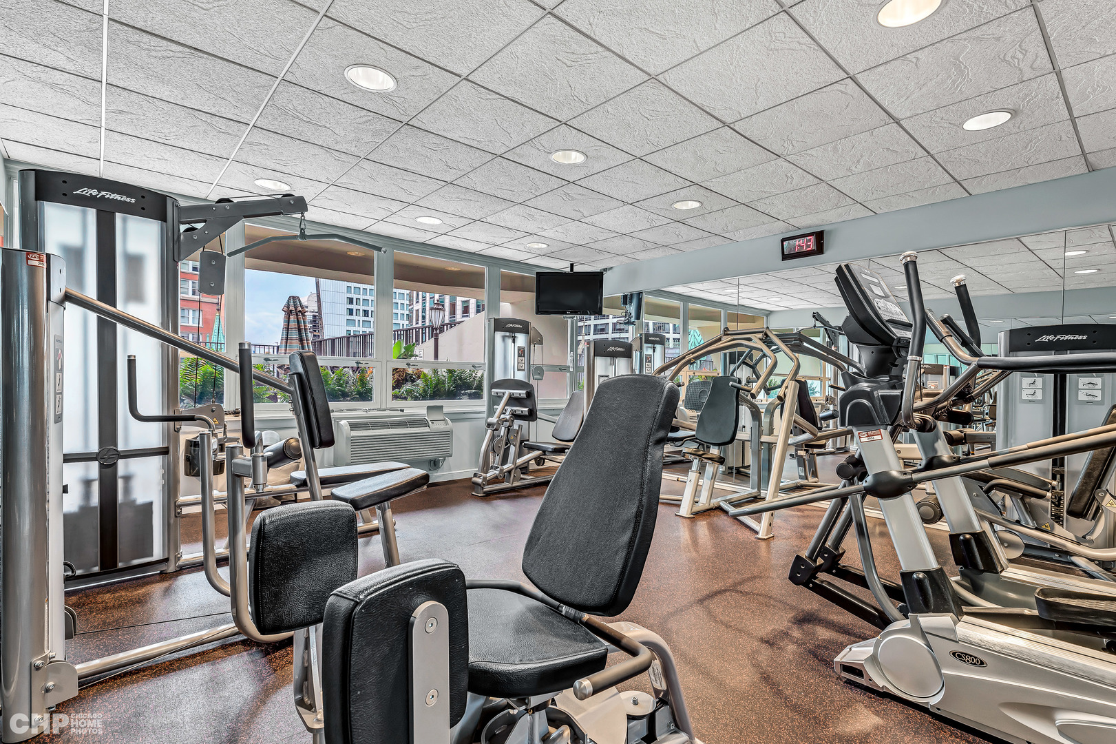 111 East Chestnut Street, Unit 49H Chicago, IL 60611 - Photo 26 of 27 a view of a room with gym equipment