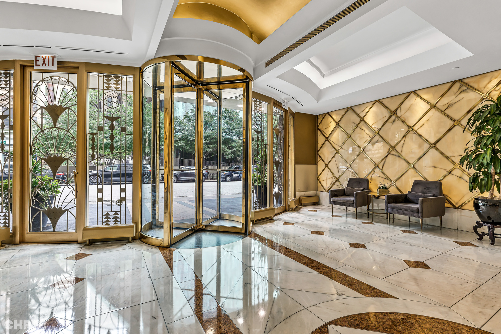 111 East Chestnut Street, Unit 49H Chicago, IL 60611 - Photo 3 of 27 a very nice looking room with a large window and a chandelier